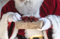 files/santa-fixes-the-bow-on-a-gift.jpg